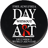 A black button with the words Philadelphia Day Without Art: December 1 World AIDS Day written in white lettering. The letter R in art red and is designed to look like an AIDS ribbon.
