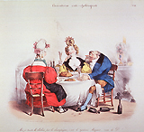 A man and two women seated at a table eating and drinking; several empty bottles are on the floor.