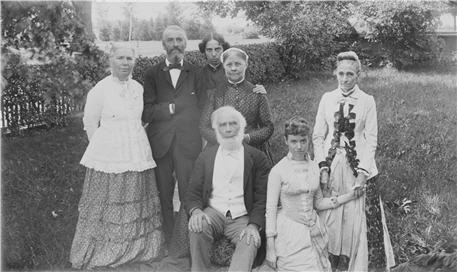 A group portrait of seven people.