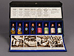 Opened sales kit shows eight glass vials representing the steps of manufacturing insulin and includes labels and photographs explaining the steps.