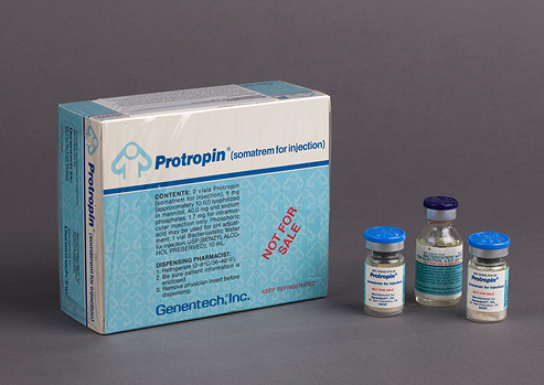 Box and three small labeled vials of Protropin.