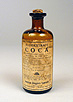 Photograph of a bottle with coca extract.