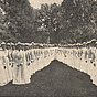Side by side groups of White nurses, on the left is a group of men, and on the right are women.