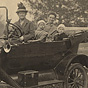 Two White women and two small White children in a car