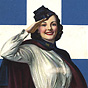 A White female nurse in white wearing a blue cape, smiles and salutes at the viewer.