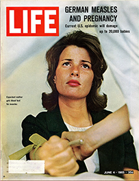 A cover of Life magazine with a photograph of a white woman getting blood drawn