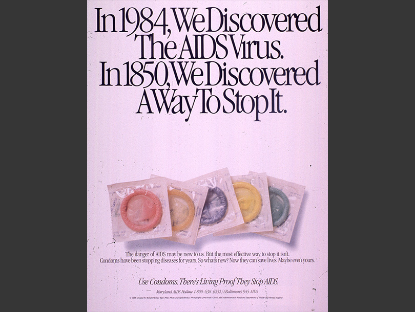 Color photograph of 5 condoms underneath text, on a pink-purple background