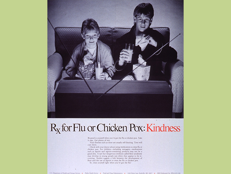 An advertisement showing text below a black and white photo of two white, adolescent boys sitting on a couch in front of a television and holding tissue boxes and glasses of orange juice