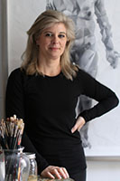 Photograph of a white woman with paintbrushes and anatomical art.