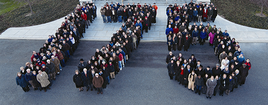 Staff stand in front of NLM in the shape of the numbers 175 for an anniversary celebration.