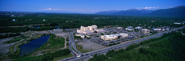Color photograph of the Alaska Native Medical Center and Southcentral Foundation as seen from the air.