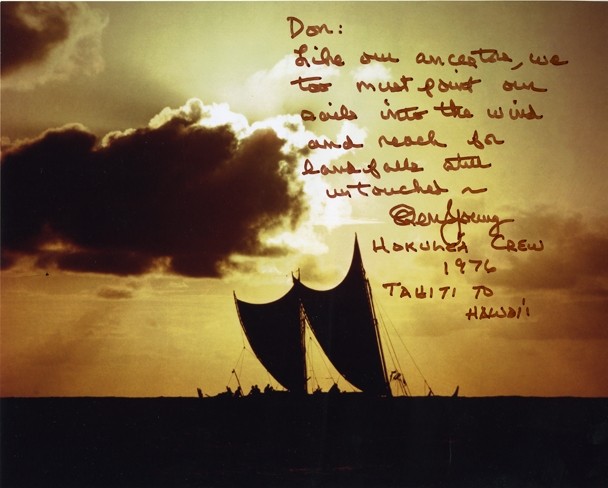 Color image depicting the silhouette of a double-hulled voyaging canoe at sea during a sunset, signed by Ben Young.