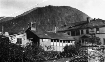 Black and white photograph of a Bureau of Indian Affairs school (on left) and U.S. Public Health Service hospital in Juneau, Alaska.