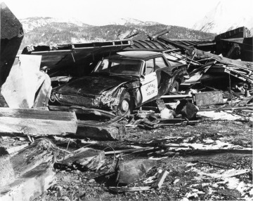 Seward squad car in a pile of wreckage following the tsunami generated by the 1964 earthquake