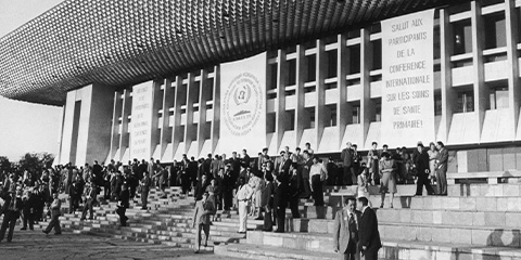 People gathered on the steps of the World Health Organization building