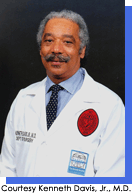Portrait style image of a man in white medical coat and tie.  Courtesy Kenneth Davis, Jr., M.D.