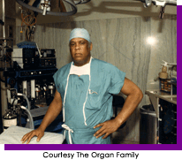 Man in green surgical scrubs and head covering standing in an operating room. Courtesy The Organ Family