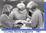 Three surgeons operating on a patient.  Courtesy Ebony Magazine