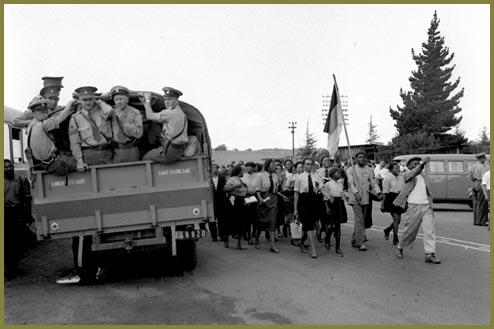 Nurses march past South African military truck