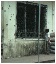 Clinic with bullet holes in its walls