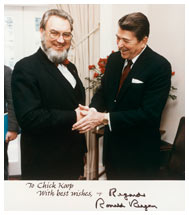 Autographed photograph of President Ronald Reagan and Surgeon General C. Everett Koop shaking hands