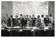 Dr. D.A. Henderson and members of the World Health Organization's Smallpox Eradication Program pose in front of large map