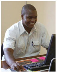 Dr. Sungano Mharakurwa at his computer
