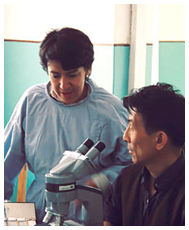 Dr. Nubia Muñoz and colleague in lab