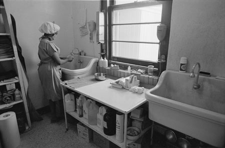 Delta Health Center surgeon washes hands at sink