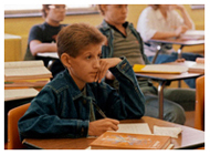 Ryan White sits at desk in class