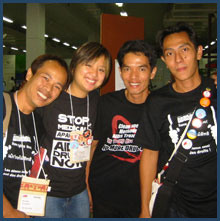 Tanya Wansom with two other young activists at a conference