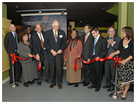 The ribbon cutting at the opening of the exhibition, from left to right, Michael Tees, Jeanne White-Ginder, Gyawu Mahama, Dr. Glass, Dr. Lindberg, Dr. Cargill, Niko and Theo Milonopoulos, Dr. Geiger and Tanyaporn Wansom
