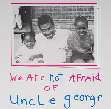 A poster with text and a portrait of an African American man with two African American girls