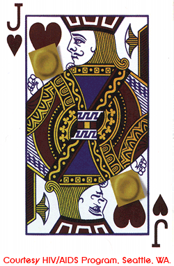 Jack of hearts playing card with the two faces of the jacks looking towards a condom placed on the card.