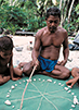 Micronesian wayfinder, Mau Piailug, uses a star compass to teach navigation to his son and others. 