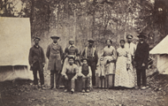 Sepia toned photograph of several African American women and men standing outdoors.  Courtesy Massachusetts Commandery Military Order of the Loyal Legion and the U.S. Military History Institute.