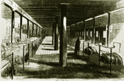 Black and white illustration of the interior interior view of a hospital ward on the U.S.S. Red Rover showing rows of beds on either side and a nurse tending to a patient. Harper's Weekly, May 9, 1863. Courtesy Harper's Weekly.