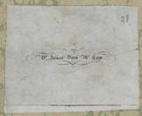 Close up of a bookplate, gray in background with black lettering, which reads: Dr. James Drew McCaw.