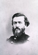 Photographic portrait of Joseph Janvier Woodward, black and white, bust, three quarters view, in U.S. Army uniform, of man with a goatee with a solemn expression.