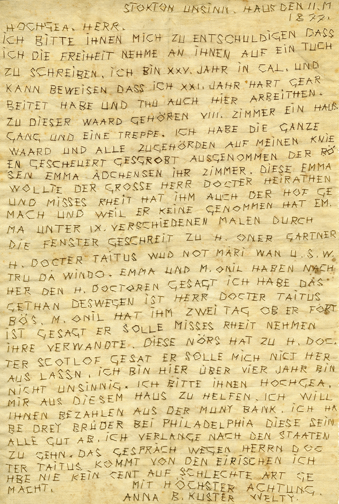 Sheet of cloth with hand-stitched text