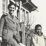 Lois Pendleton Todd with a patient on the steps of the Williams-Porter Hospital in Tehchow, Shantung, China, 1920s