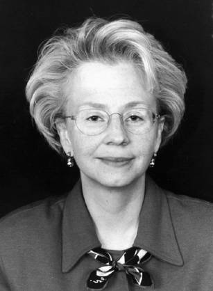 Dr. Denise L. Faustman, a White woman in a collared blouse and glasses posing for her portrait.