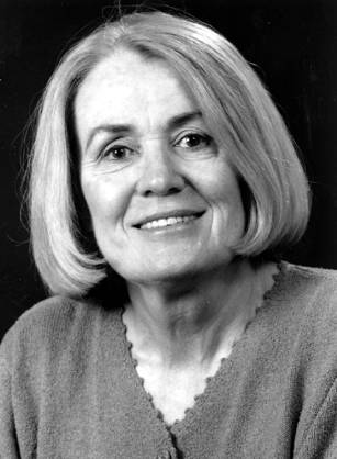 Dr. Mary Elizabeth Guinan, a smiling White woman with short cropped hair.