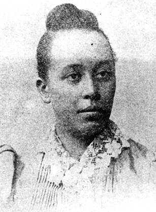 Dr. Halle Tanner Dillon Johnson, an African American woman with her hair in a bun.