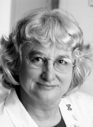 Dr. Jennifer R. Niebyl, a White woman with glasses and in a lab coat posing for her portrait.