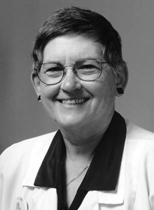 Dr. Judith Ann Pachciarz, a White woman with short hair and glasses in a lab coat.