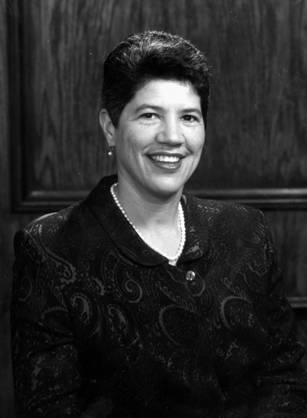 Dr. Deborah Prothrow-Stith, a smiling African American woman in pearls posing for her portrait.