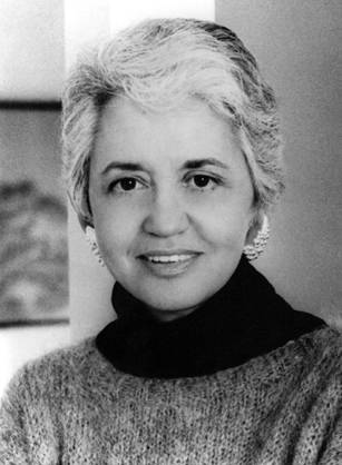 Dr. Rachel Naomi Remen, a woman with short hair wearing a turtleneck sweater posing for her portrait.