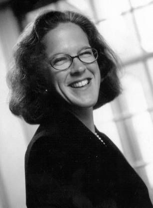 Dr. Laurel Wysong Rice, a smiling White woman with short hair posing for her portrait.