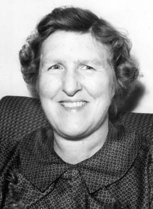 Dr. Marian Wilkins Ropes, a White woman in a collared blouse smiling for her portrait.